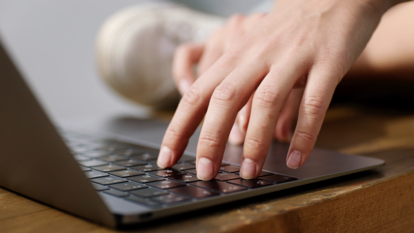 Fingers Typing on Keyboard