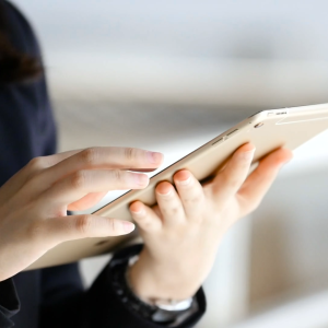 Person Using Touchscreen Tablet