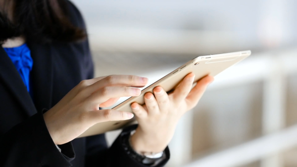 Person Using Touchscreen Tablet