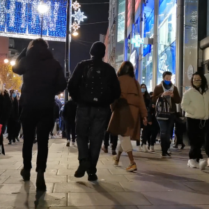 Pedestrians Walking on Busy Street