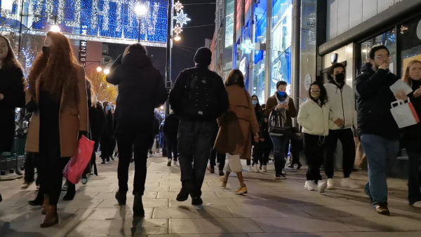 Pedestrians Walking on Busy Street